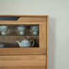 NordicStory Massivholzvitrine Eiche Bremen 3, 124 x 38 x 134 cm.
